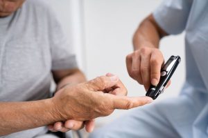 A man having his blood sugar levels checked for diabetes.