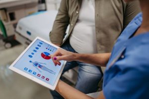 A female doctor consulting with a patient about their health.