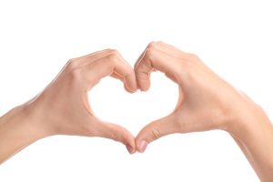 Hands making the heart shape.