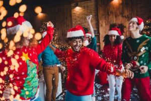 Young people having fun dancing at a Christmas party.